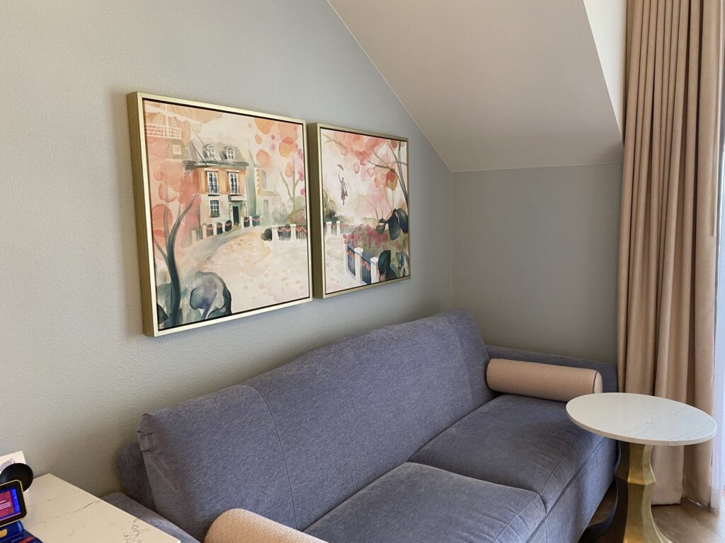 Couch inside of standard two queen guestroom at Disney's Grand Floridian review